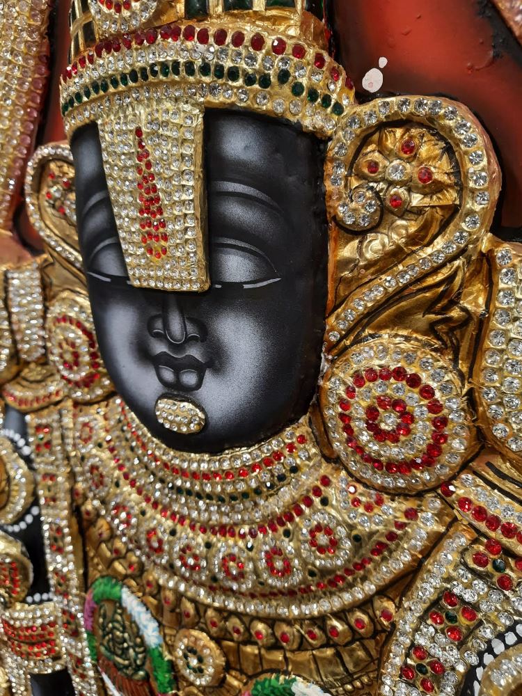 Tirupati Balaji Tanjore painting in a wooden frame with intricate gold details and vibrant colors.